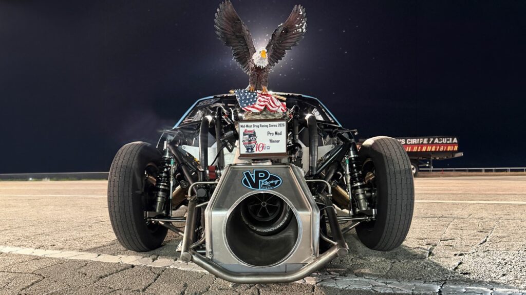 Murder Nova's Blue with winners trophy in front of it