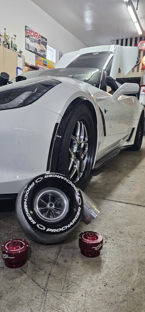 Michael Recchia ProCharger in front of C7